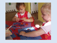 Lauren G and Lauren T - we enjoy messy play, we stick, cut, paint, make and bake as part of our messy play